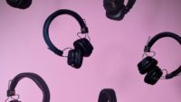 mother's day playlist banner with pink background and floating earphones